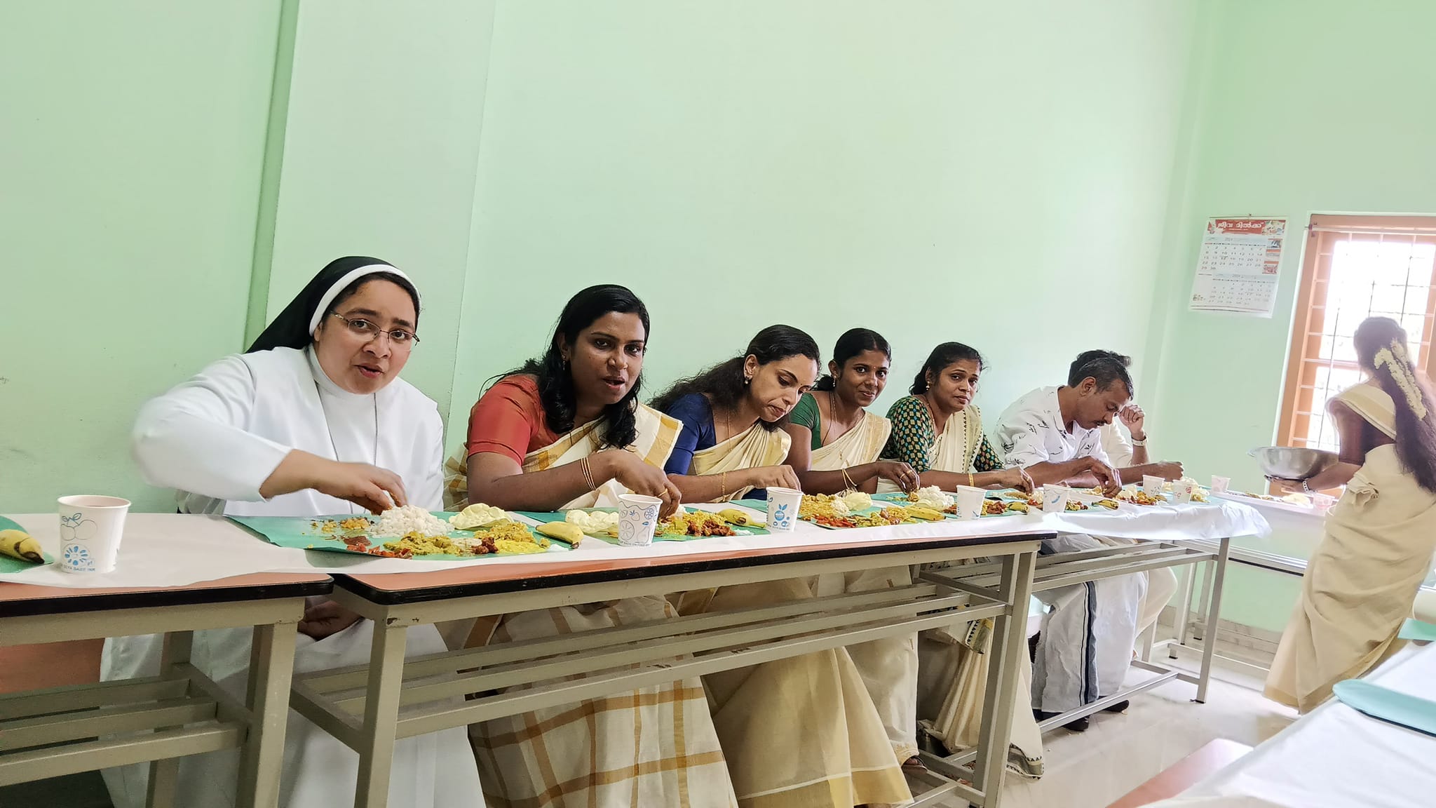 Students practicing teamwork during a group project at Carmelgiri College